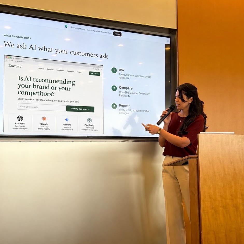 Golara Serio presenting at AI-Powered Women DC's AI Show & Tell, beside a screen that reads: We ask AI what your customers ask